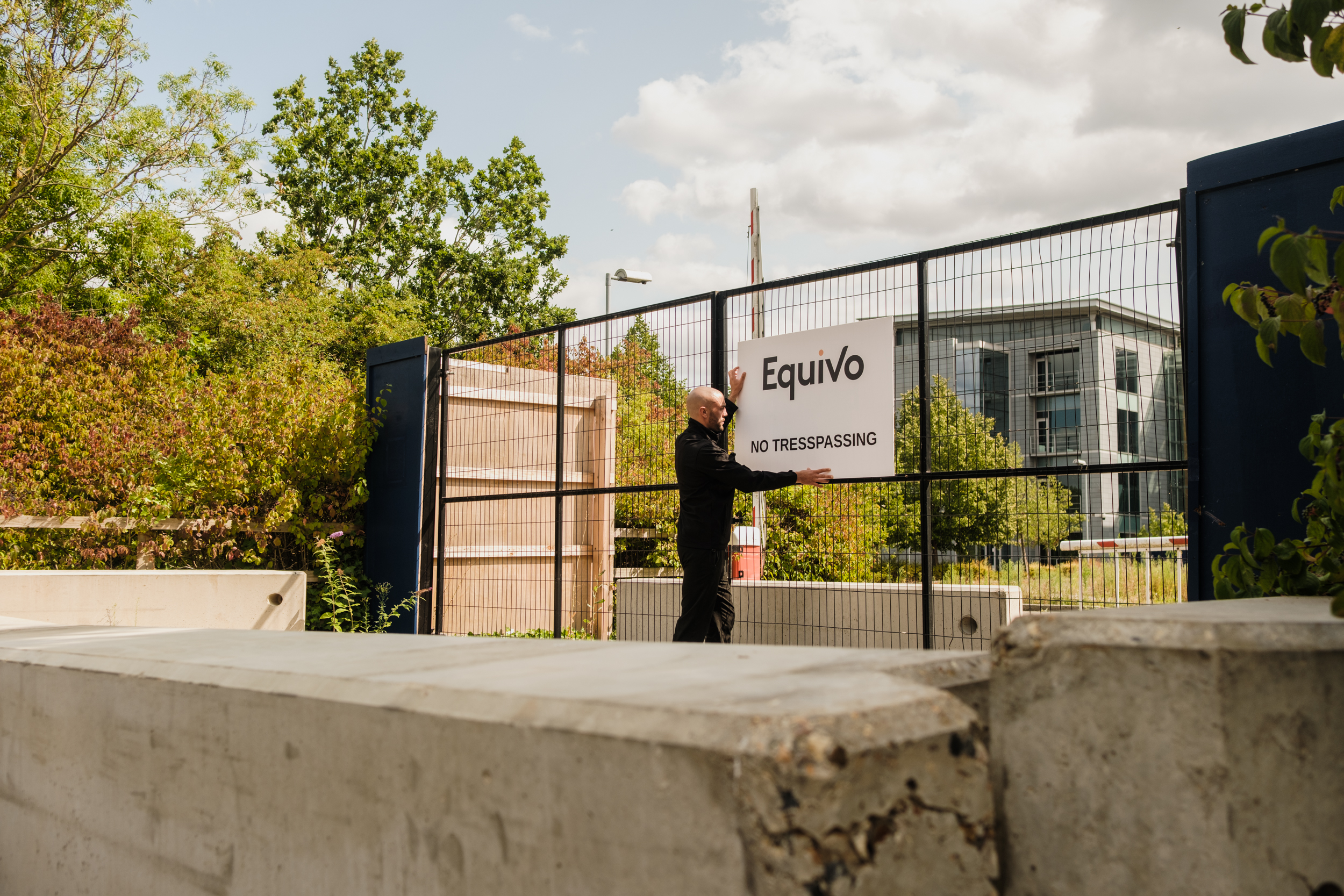 Enforcement agent putting up a no trespassing sign