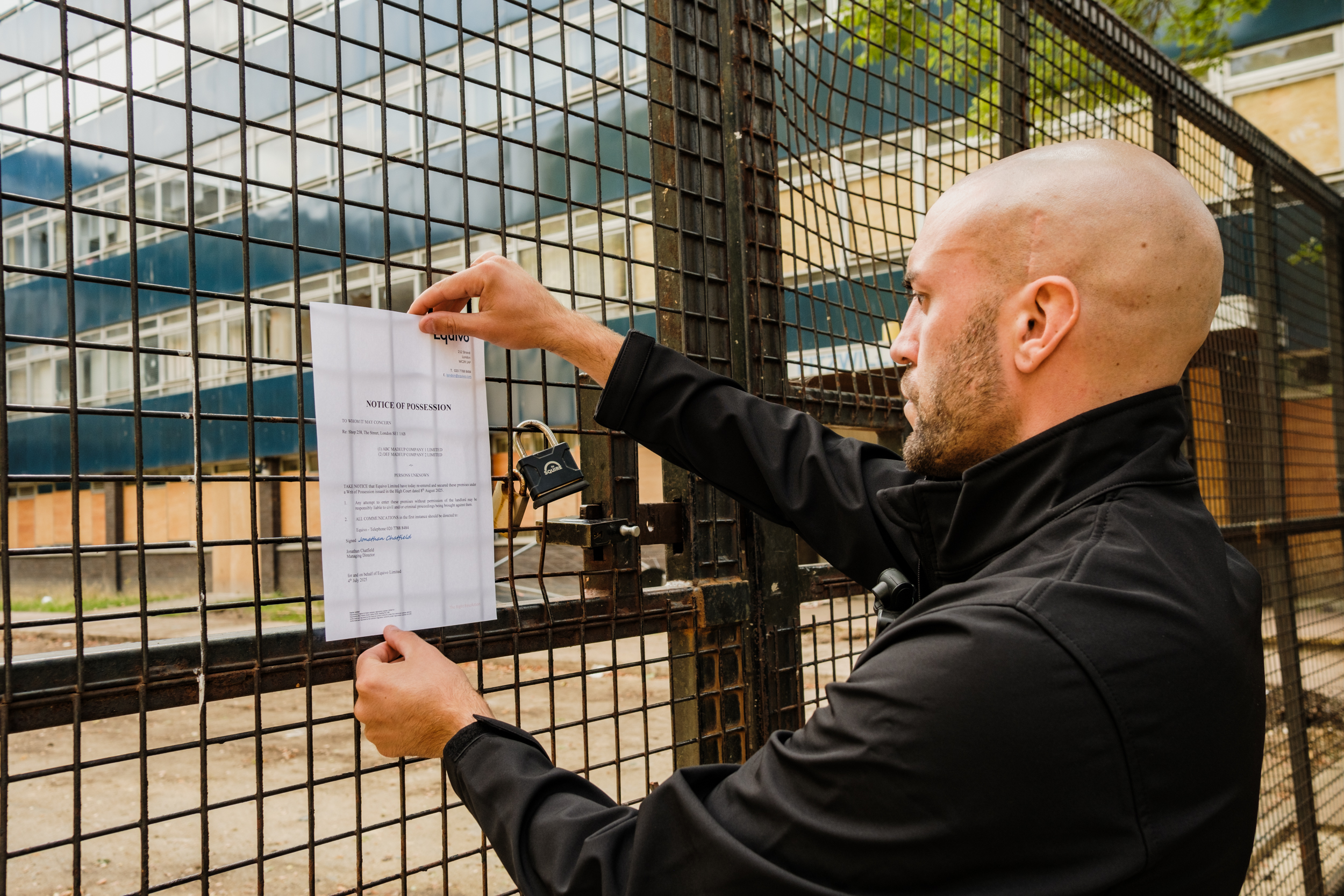 Enforcement agent putting up a notice
