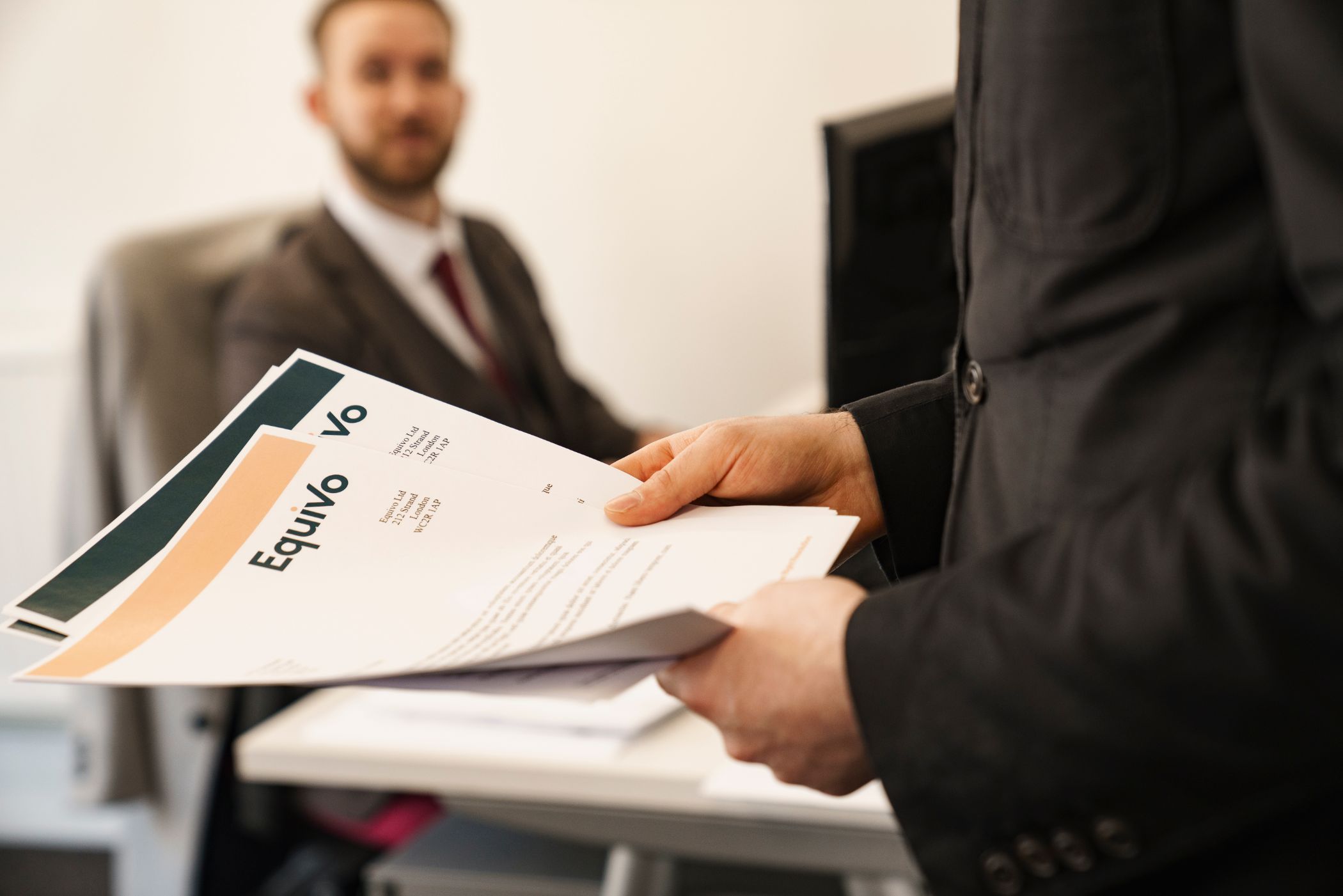 Professional is holding paperwork for a debt collection job