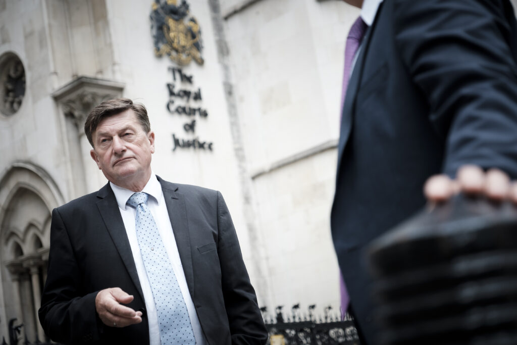 High court enforcement officer outside the Royal Courts of Justice