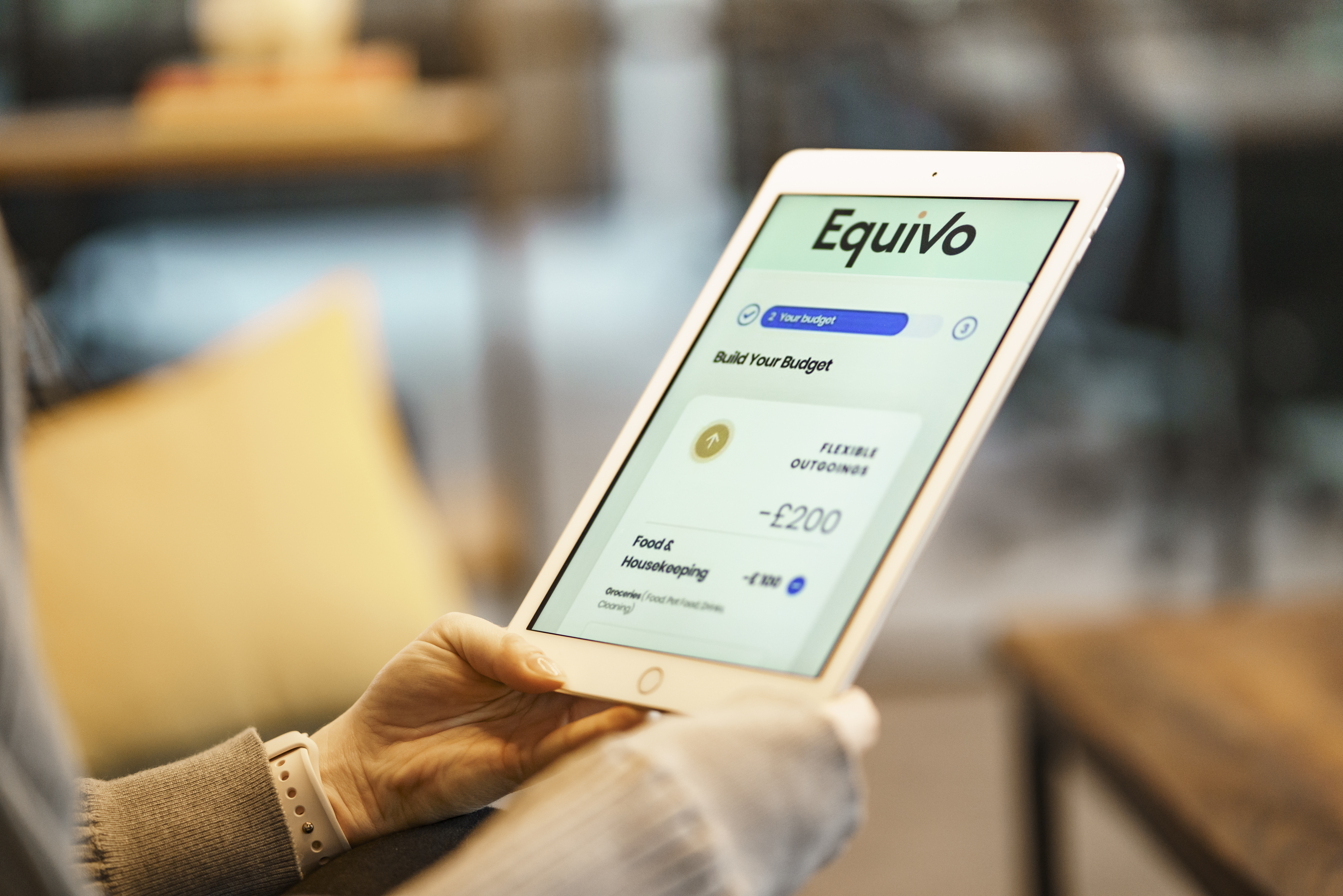 a customer using an ipad using Equivo's tool to manage their budget