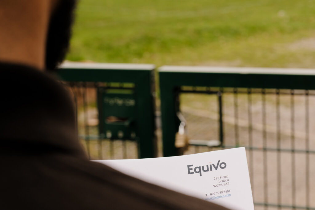 Agent at a traveller eviction site with Equivo paperwork
